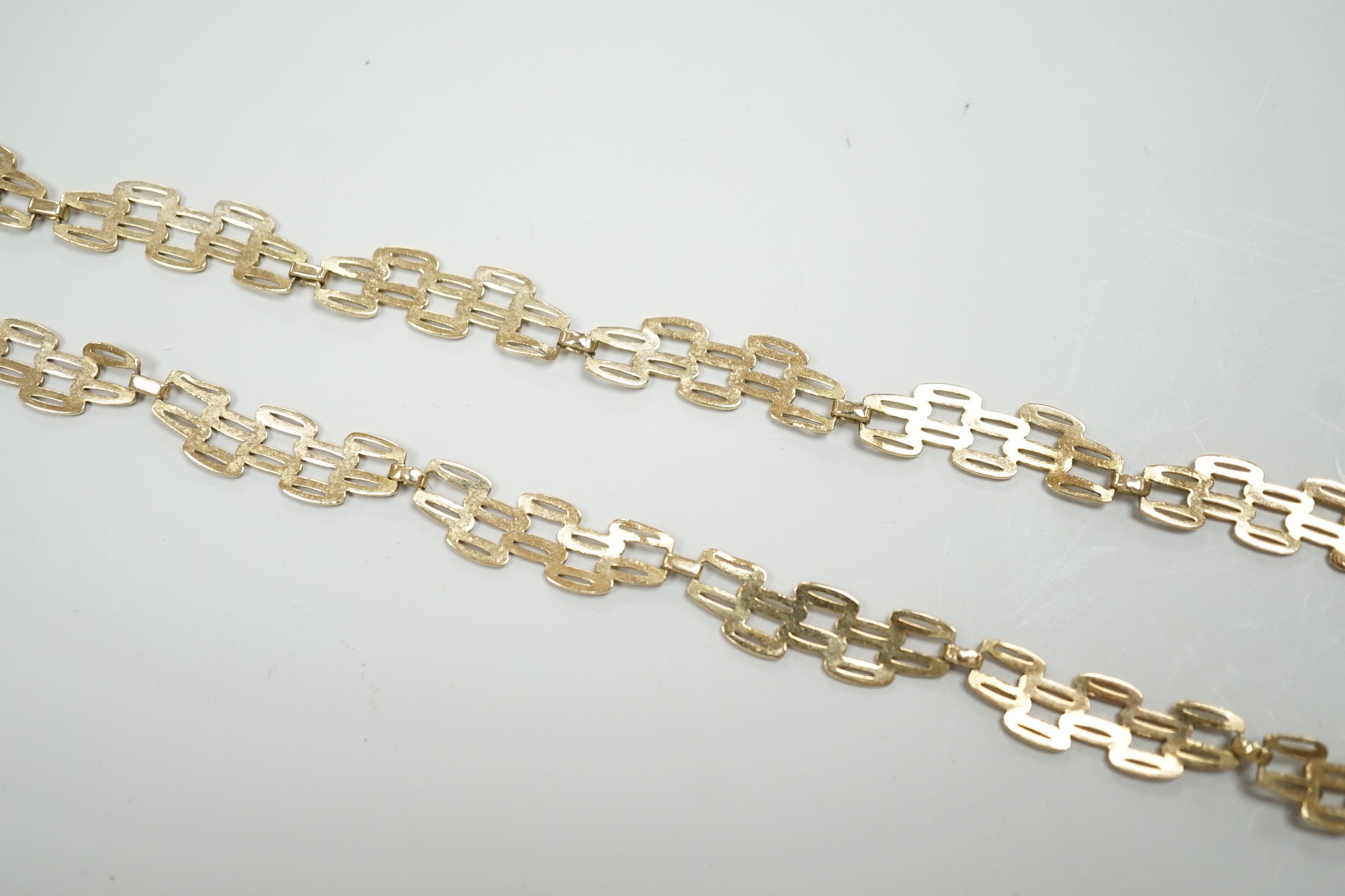 A 9ct gold pierced fancy link necklace, 45cm, 11 grams.